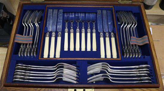 An Elkington part service of plated Lily pattern flatware, crested (109-pce) and twelve pairs of bone-handled fruit eaters,